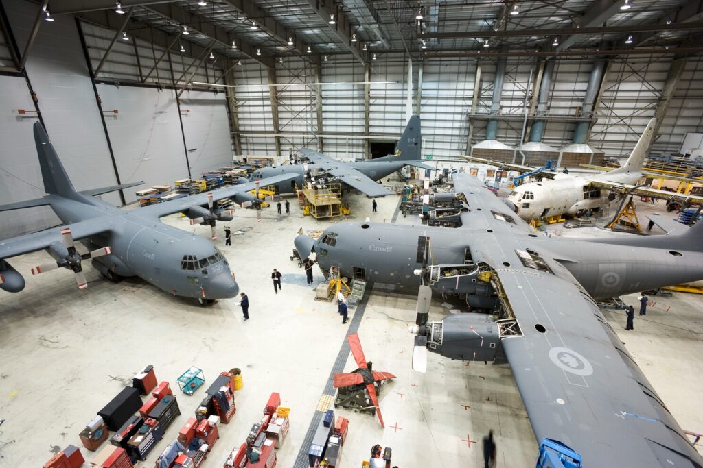 IMP Aerospace & Defence team performing aircraft maintenance in a hangar facility